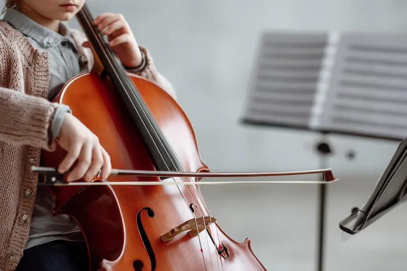 cello lessons Grosse Pointe MI student playing cello during private lesson